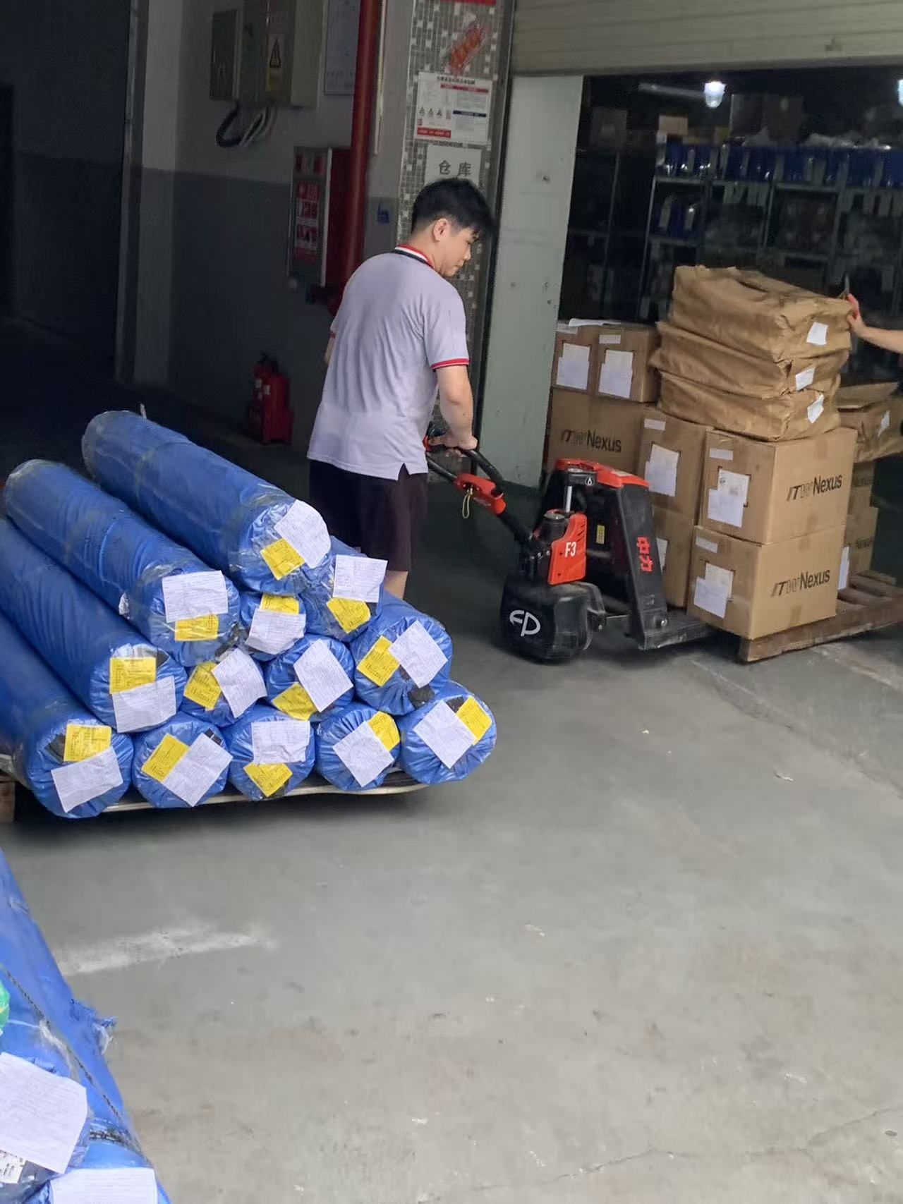 Strict QA material traceability tag on a pallet of custom ABS top covers manufactured by Anyang Plastic.