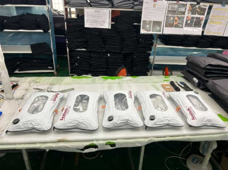 Row of compressed travel vacuum bags resting during a 24-hour air-leak check